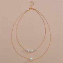 A refined necklace with two layers of pearls on a gold chain, emphasizing the luxurious 18K gold-plated design.