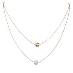 Two gold and white pearls on a chain, forming a sophisticated layered necklace with 18K gold-plated beads.