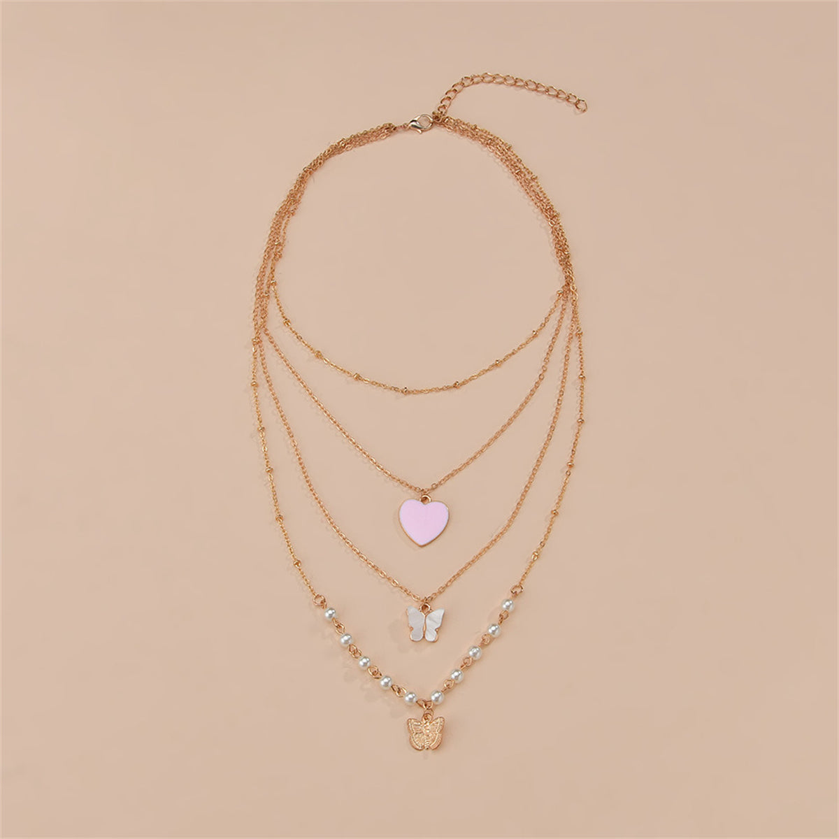 A stylish pink heart necklace with a butterfly charm and pearls, featuring a luxurious 18K gold-plated finish.