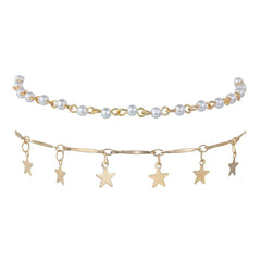 A stunning gold chain anklet with star and pearl details, enhanced by a stylish tassel for a refined appearance.