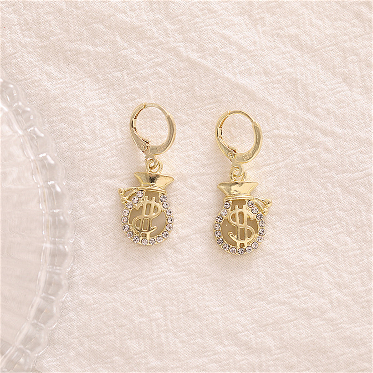 Cubic Zirconia and 18K Gold-Plated Wallet US Dollars Sign Drop Earrings, gold huggie earrings, detail close-up