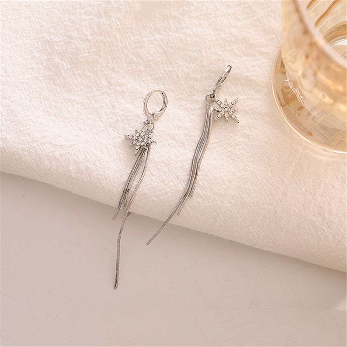 Cubic Zirconia and Silver-Plated Star Tassel Drop Earrings, silver huggie earrings, vintage-inspired design, lifestyle look