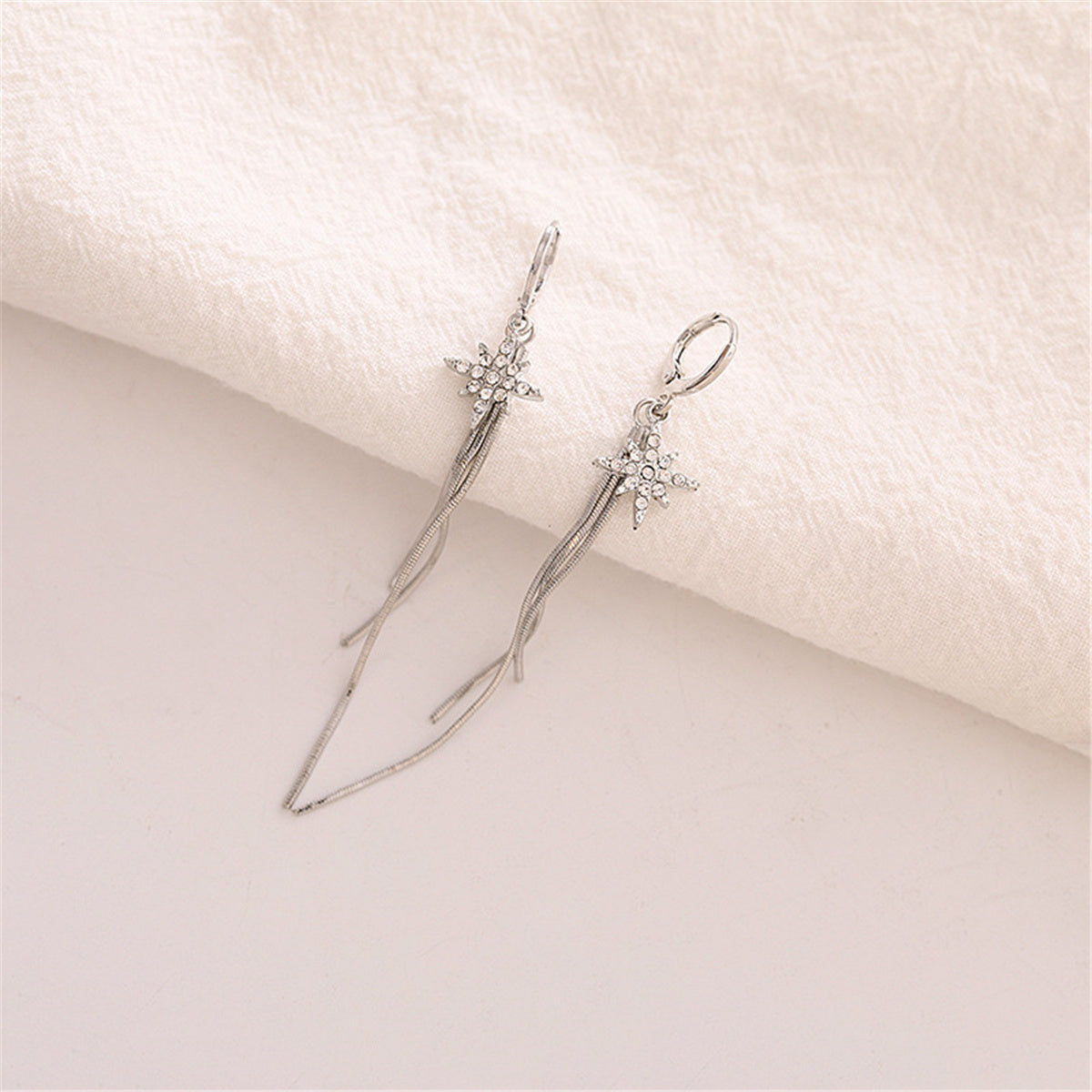 Cubic Zirconia and Silver-Plated Star Tassel Drop Earrings, silver huggie earrings, vintage-inspired design, detail close-up