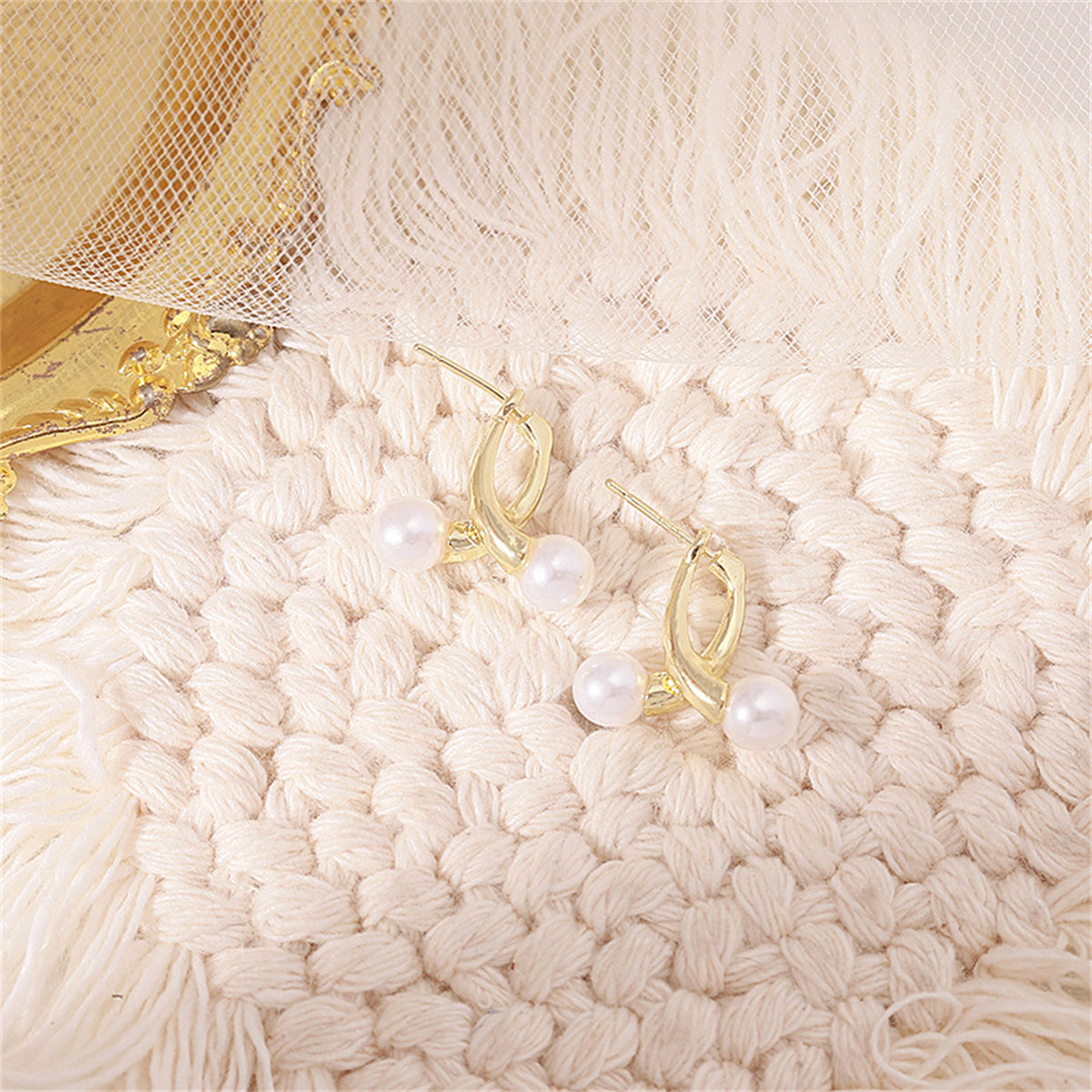 Pearl and 18K Gold-Plated Overlapping Ear Jackets, gold stud earrings for women, vintage-inspired design, lifestyle look