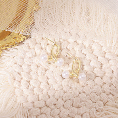Pearl and 18K Gold-Plated Overlapping Ear Jackets, gold stud earrings for women, vintage-inspired design, lifestyle look