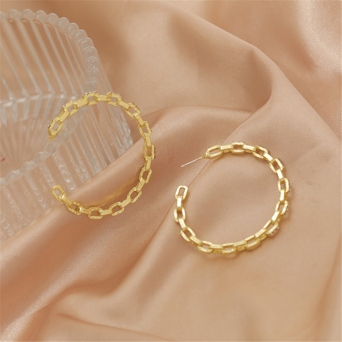 Cubic Zirconia and 18K Gold-Plated Chain Hoop Earrings, botanical inspired, detail close-up