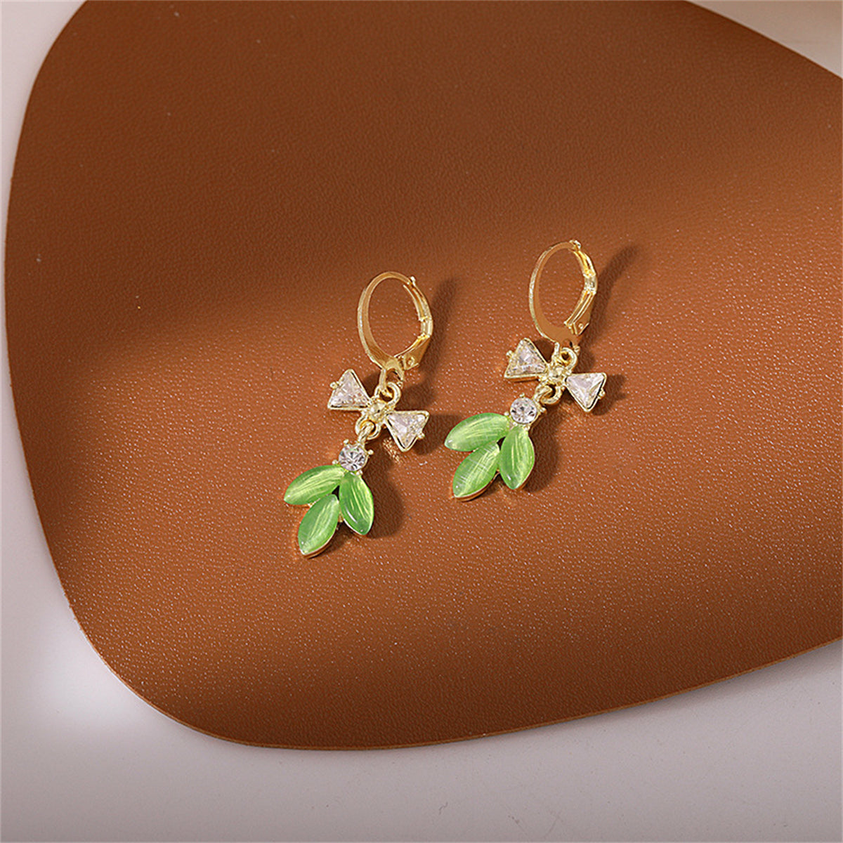 Green Cat's Eye and Cubic Zirconia Bow Leaves Huggie Earrings, huggie earrings, botanical inspired, front view
