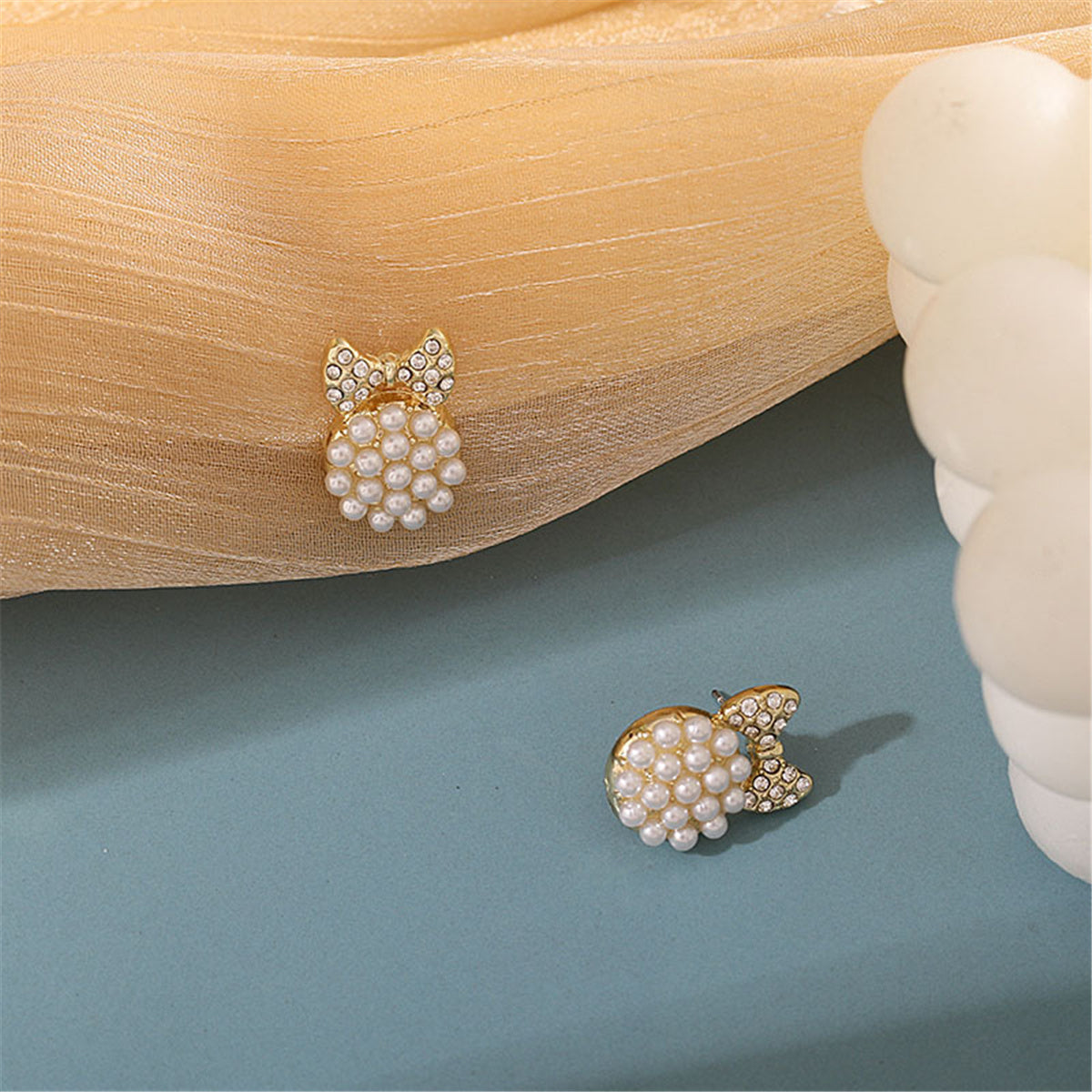 Cubic Zirconia and Pearl Bow Round Stud Earrings, stud earrings for women, vintage-inspired design, detail close-up