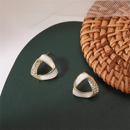 Cubic Zirconia and 18K Gold-Plated Twisted Triangle Stud Earrings, gold stud earrings for women, detail close-up