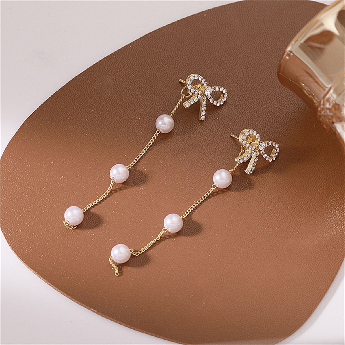 Cubic Zirconia and Pearl 18K Gold-Plated Bow Dangle Ear Jackets, gold drop earrings for women, everyday style, front view