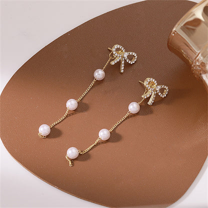 Cubic Zirconia and Pearl 18K Gold-Plated Bow Dangle Ear Jackets, gold drop earrings for women, everyday style, front view