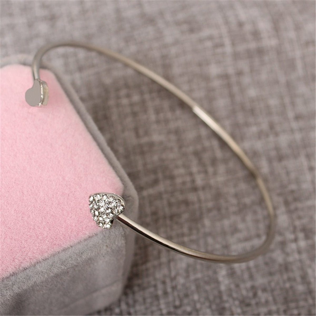 Cubic Zirconia and Silver-Plated Heart Cuff, silver bracelet for women, dainty minimalist design, detail close-up