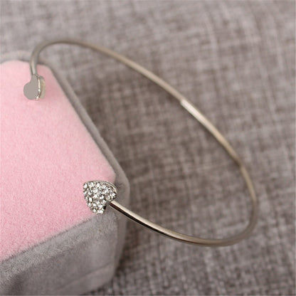 Cubic Zirconia and Silver-Plated Heart Cuff, silver bracelet for women, dainty minimalist design, detail close-up