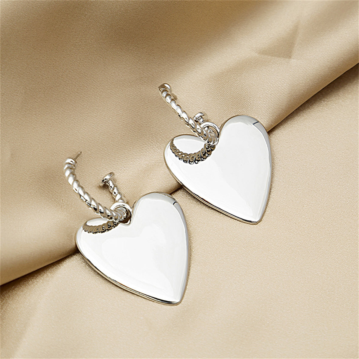 Silver-Plated Heart Huggie Earrings, silver huggie earrings, dainty minimalist design, lifestyle look