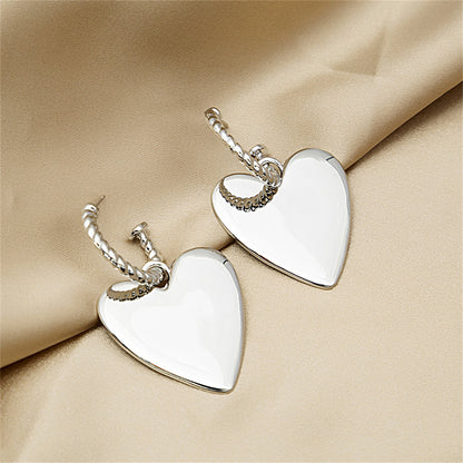 Silver-Plated Heart Huggie Earrings, silver huggie earrings, dainty minimalist design, lifestyle look