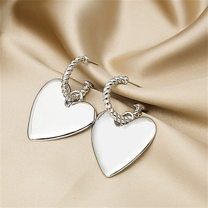 Silver-Plated Heart Huggie Earrings, silver huggie earrings, dainty minimalist design, side view
