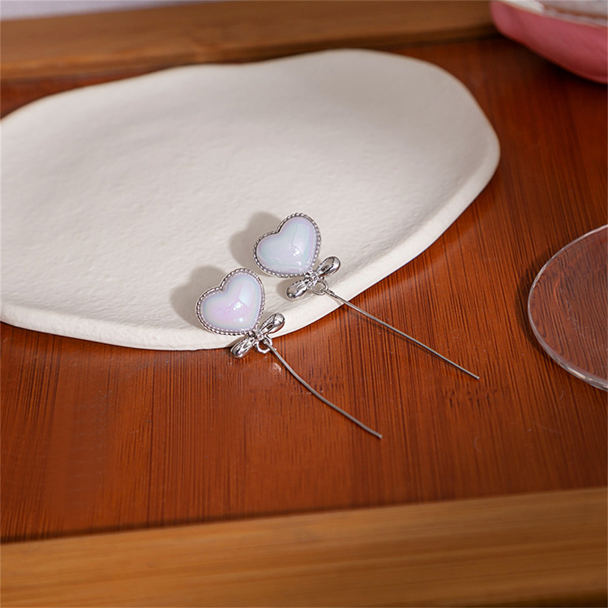 Pearl and Silver-Plated Heart Bow Drop Earrings, silver drop earrings for women, botanical inspired, side view