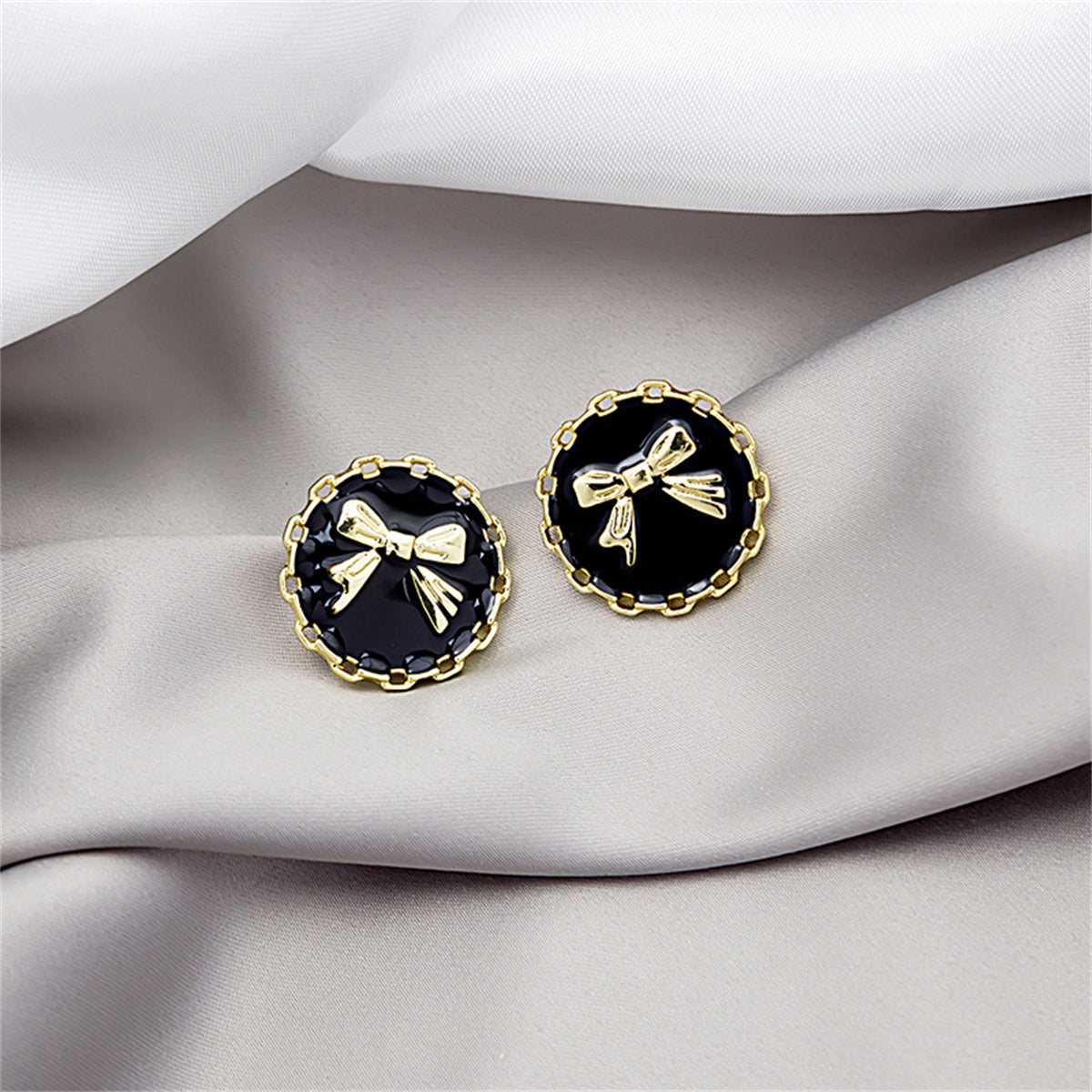 Black Enamel and 18K Gold-Plated Bow Round Stud Earring, gold stud earrings for women, vintage-inspired design, front view