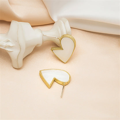 White Enamel and 18K Gold-Plated Bordered-Heart Huggie Earrings, gold huggie earrings, lifestyle look