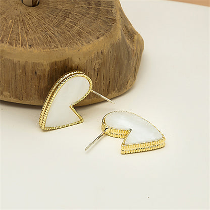 White Enamel and 18K Gold-Plated Bordered-Heart Huggie Earrings, gold huggie earrings, vintage-inspired design, side view