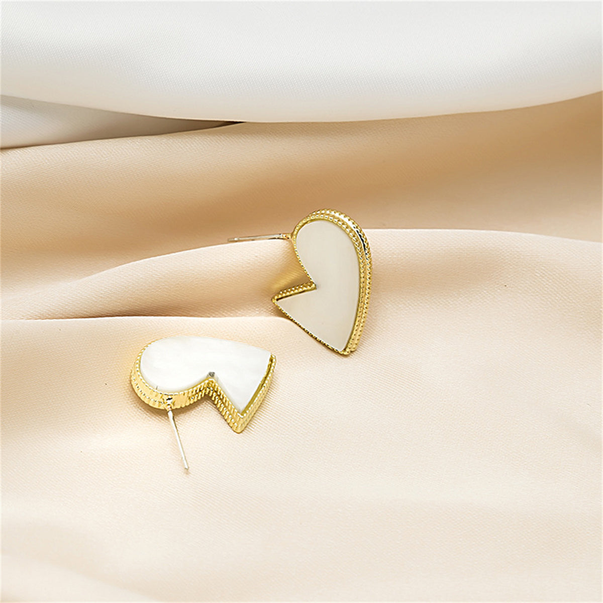 White Enamel and 18K Gold-Plated Bordered-Heart Huggie Earrings, gold huggie earrings, detail close-up