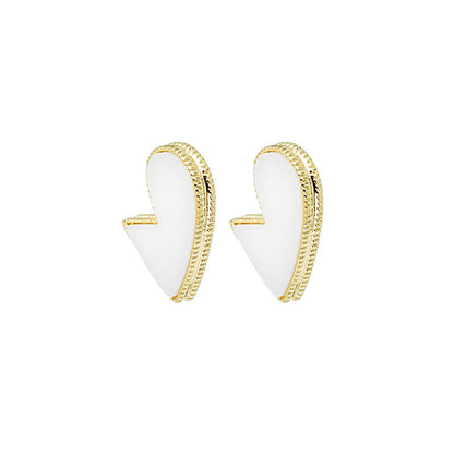 White Enamel and 18K Gold-Plated Bordered-Heart Huggie Earrings, gold huggie earrings, vintage-inspired design, styled look