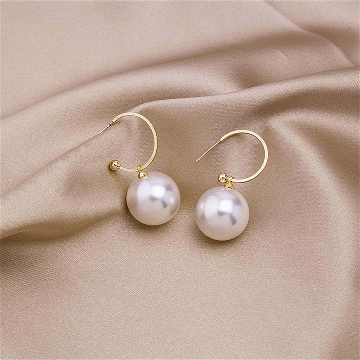 Pearl and 18K Gold-Plated Huggie Earrings, gold huggie earrings, everyday style, front view
