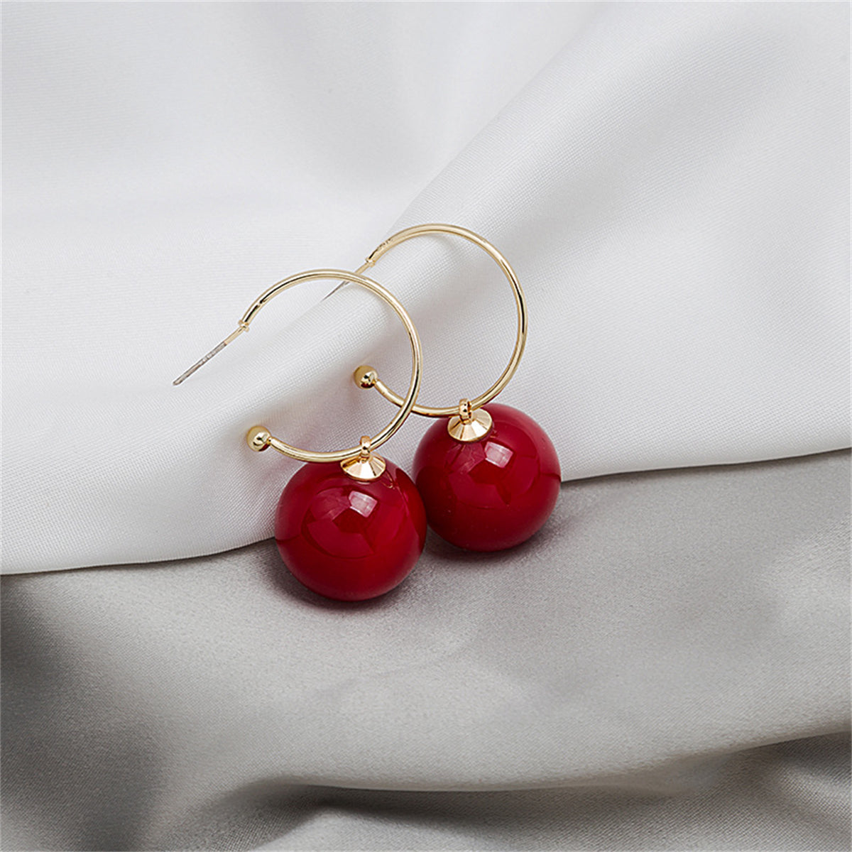 Red Pearl and 18K Gold-Plated Huggie Earrings, gold huggie earrings, dainty minimalist design, detail close-up