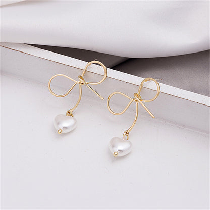 Pearl and 18K Gold-Plated Bow and Heart Drop Earrings, gold drop earrings for women, vintage-inspired design, lifestyle look