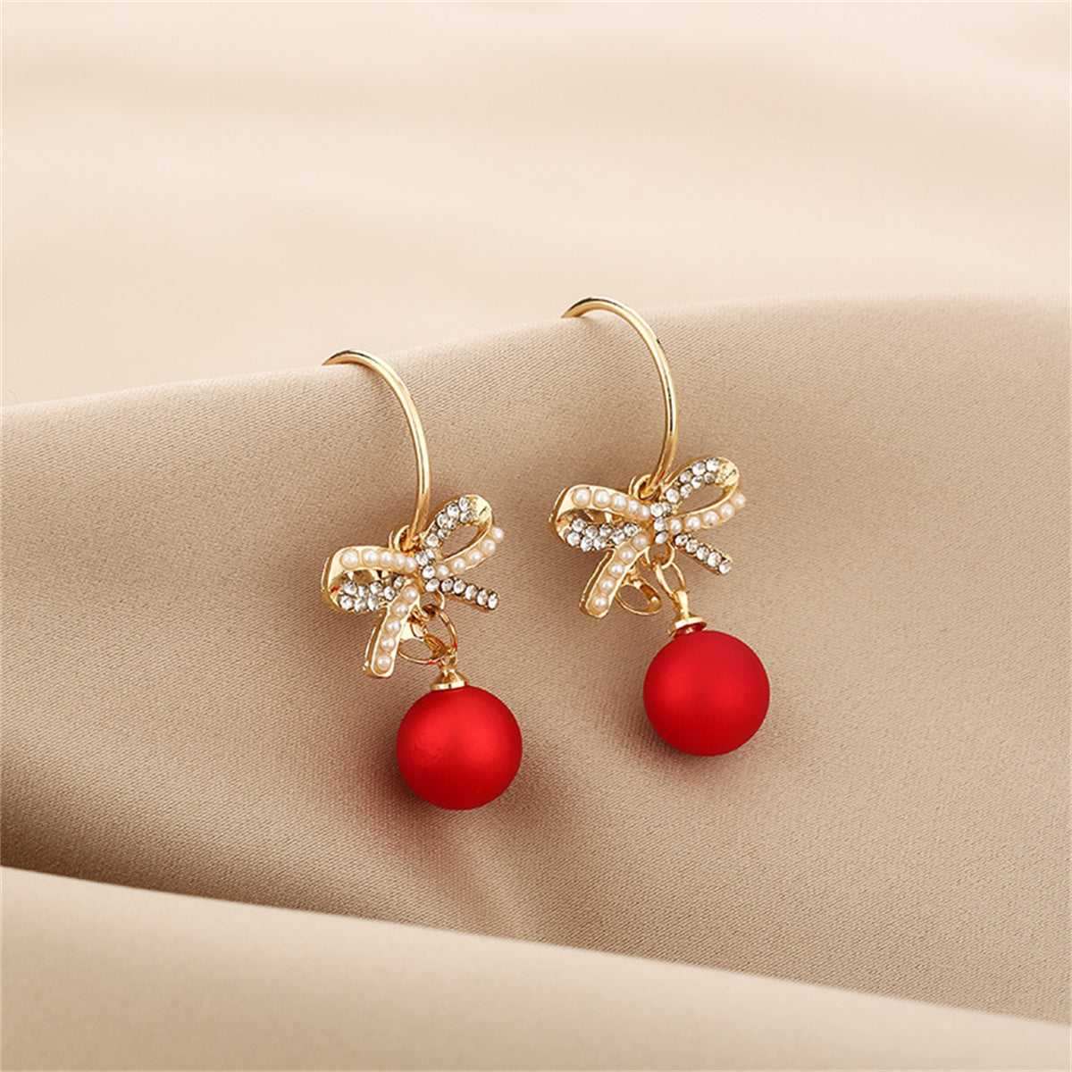 Red Resin and Pearl Cubic Zirconia Bow Huggie Earrings, huggie earrings, botanical inspired, detail close-up