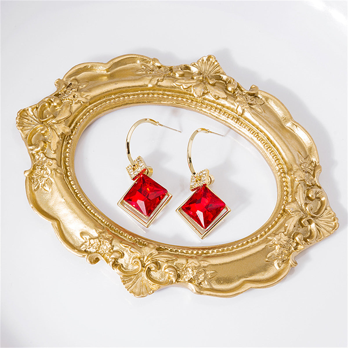 Red Princess Crystal and Clear Cubic Zirconia Huggie Earrings, huggie earrings, botanical inspired, side view