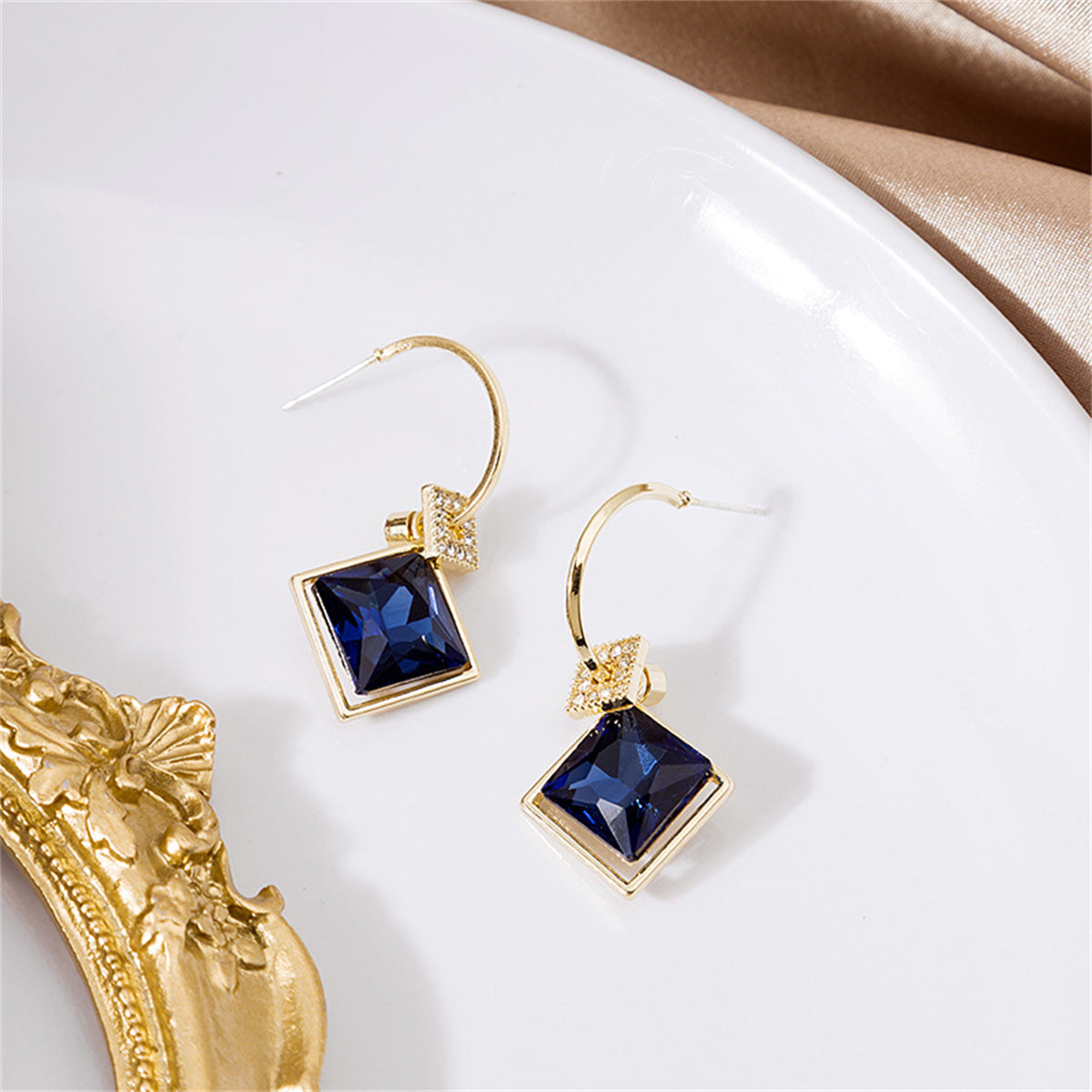 Blue Princess Crystal and Cubic Zirconia Huggie Earrings, huggie earrings, botanical inspired, detail close-up