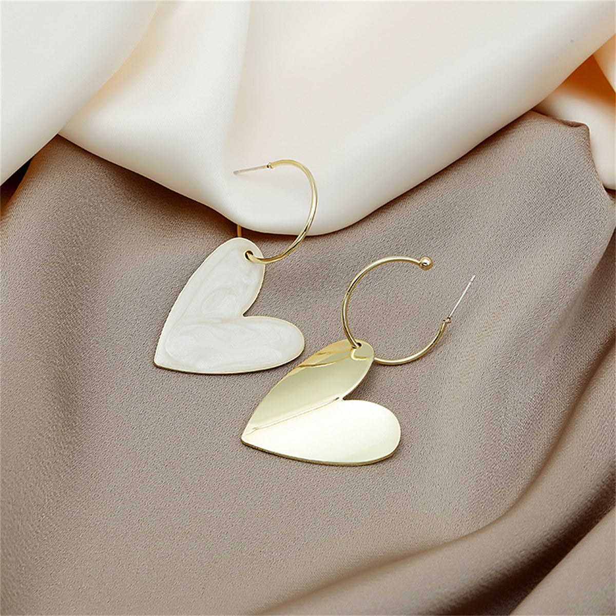 White Enamel and 18K Gold-Plated Heart Huggie Earrings, gold huggie earrings, dainty minimalist design, front view