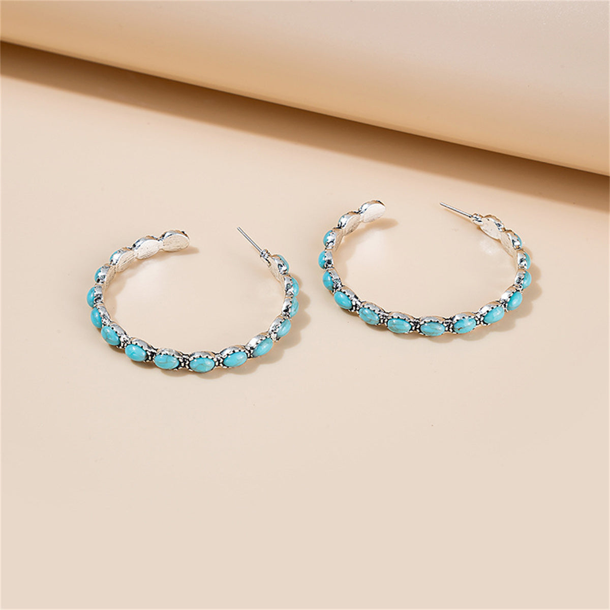 Blue Turquoise and Silver-Plated Oval-Cut Hoop Earrings, vintage-inspired design, side view