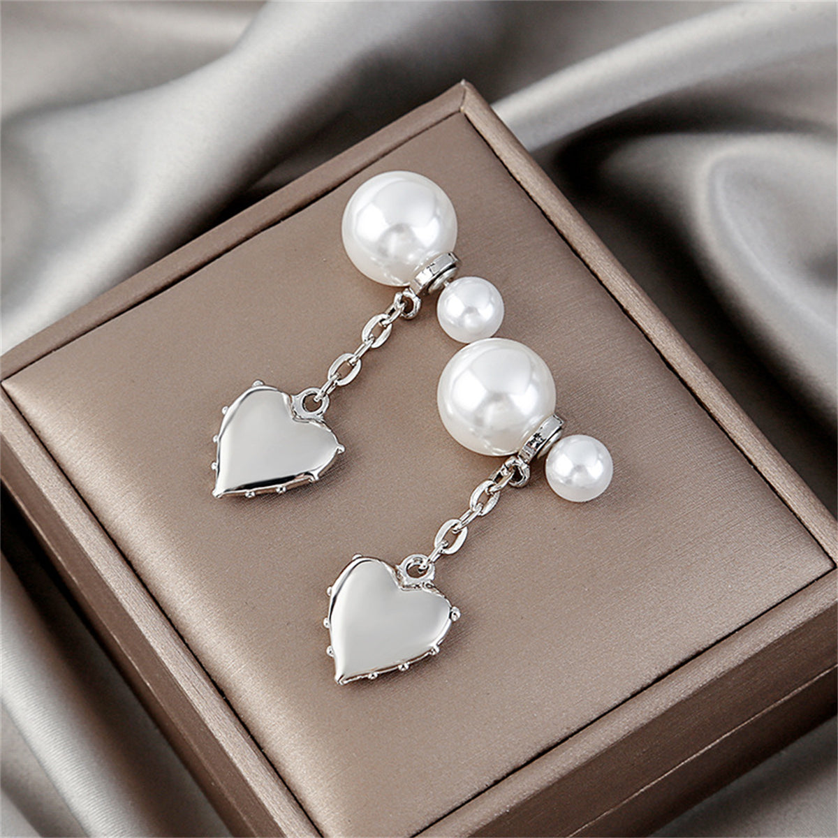 Pearl and Silver-Plated Heart Drop Ear Jackets, silver drop earrings for women, vintage-inspired design, lifestyle look