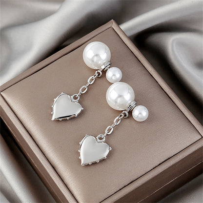 Pearl and Silver-Plated Heart Drop Ear Jackets, silver drop earrings for women, vintage-inspired design, lifestyle look