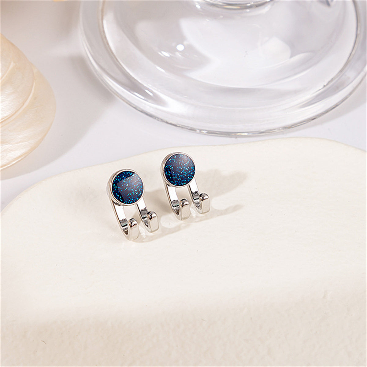 Silver-Plated and Blue Hook Ear Jackets, silver stud earrings for women, botanical inspired, front view
