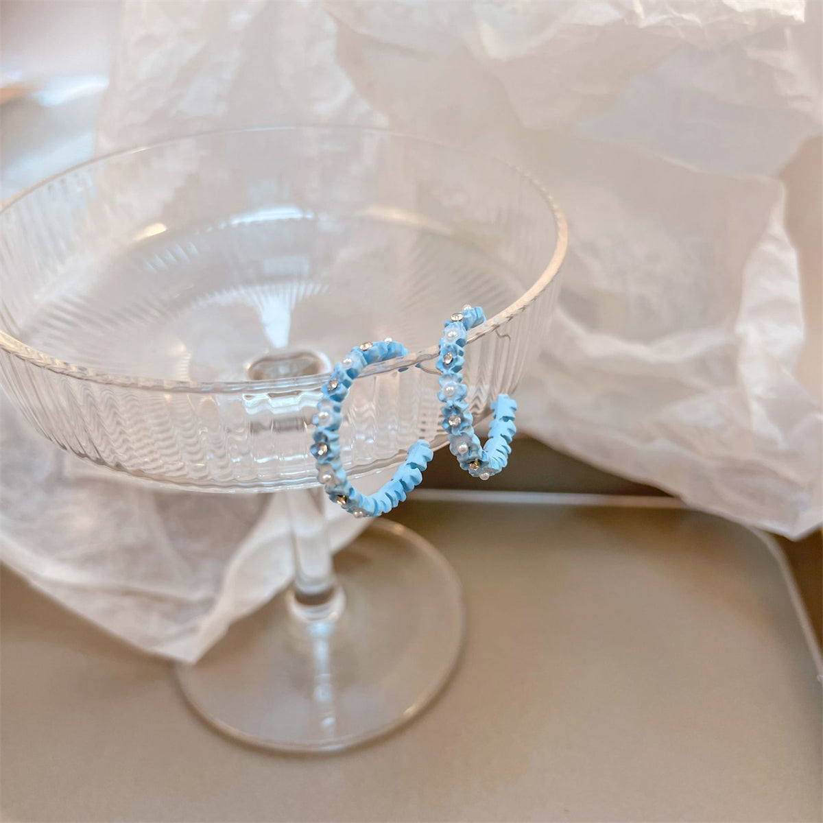 Pearl and Cubic Zirconia Blue Flower Huggie Earrings, huggie earrings, vintage-inspired design, lifestyle look