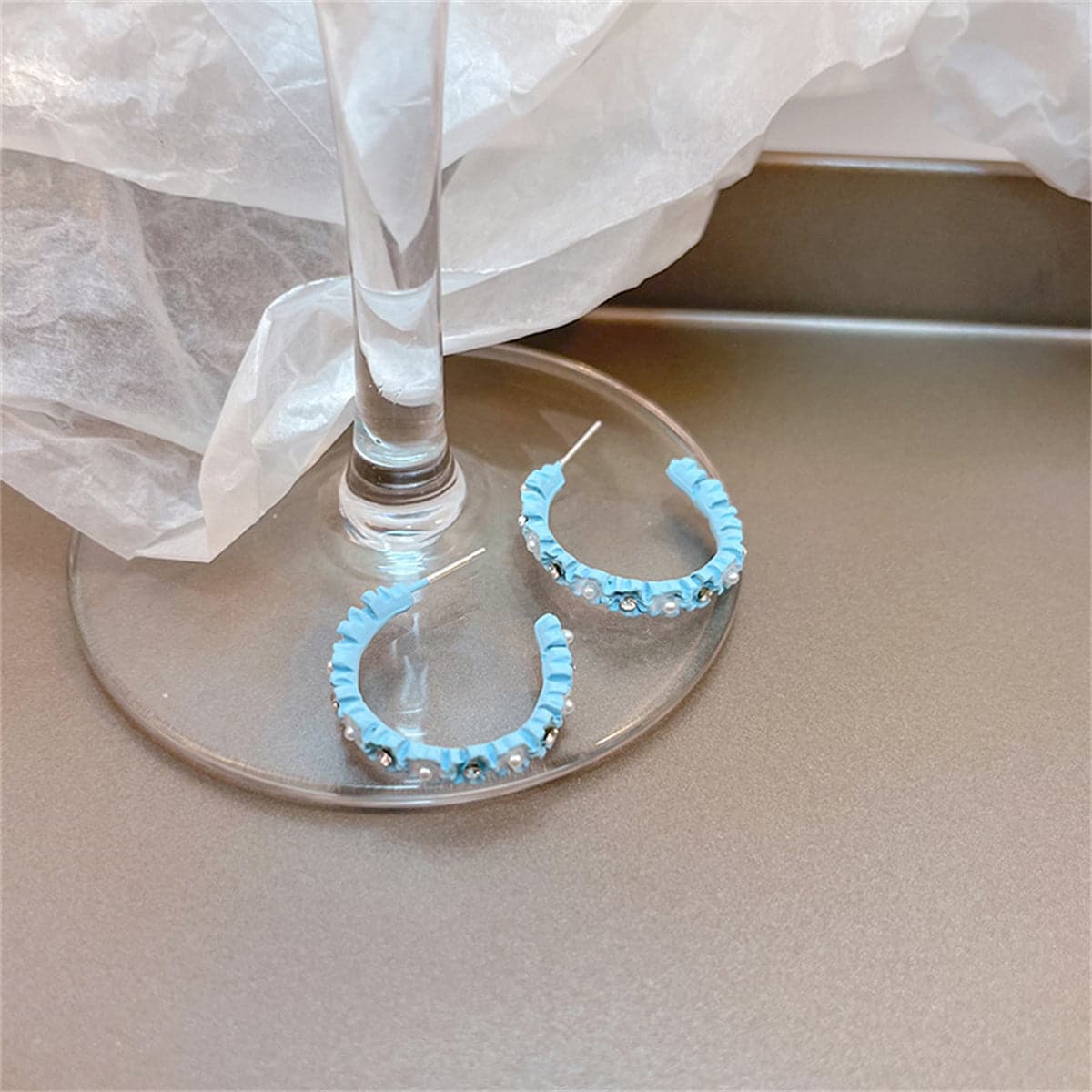Pearl and Cubic Zirconia Blue Flower Huggie Earrings, huggie earrings, vintage-inspired design, front view