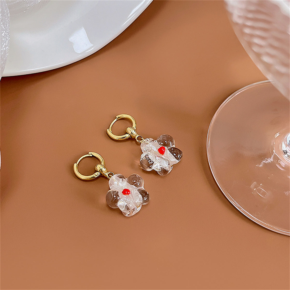 Clear Resin and 18K Gold-Plated Flower Huggie Earrings, gold huggie earrings, vintage-inspired design, front view