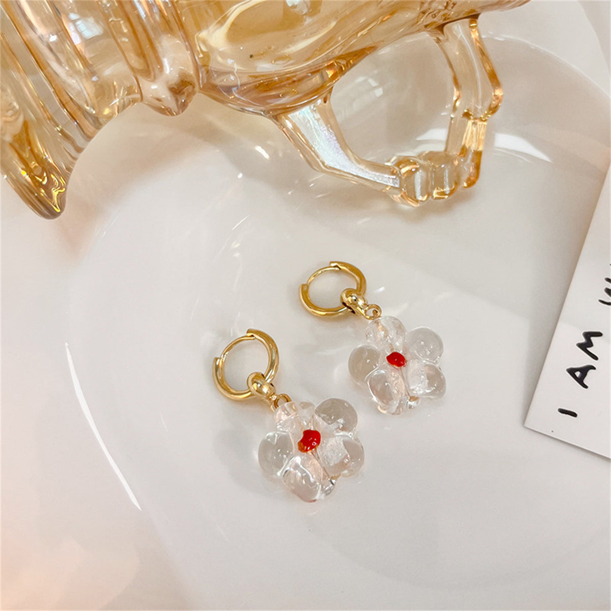 Clear Resin and 18K Gold-Plated Flower Huggie Earrings, gold huggie earrings, vintage-inspired design, side view
