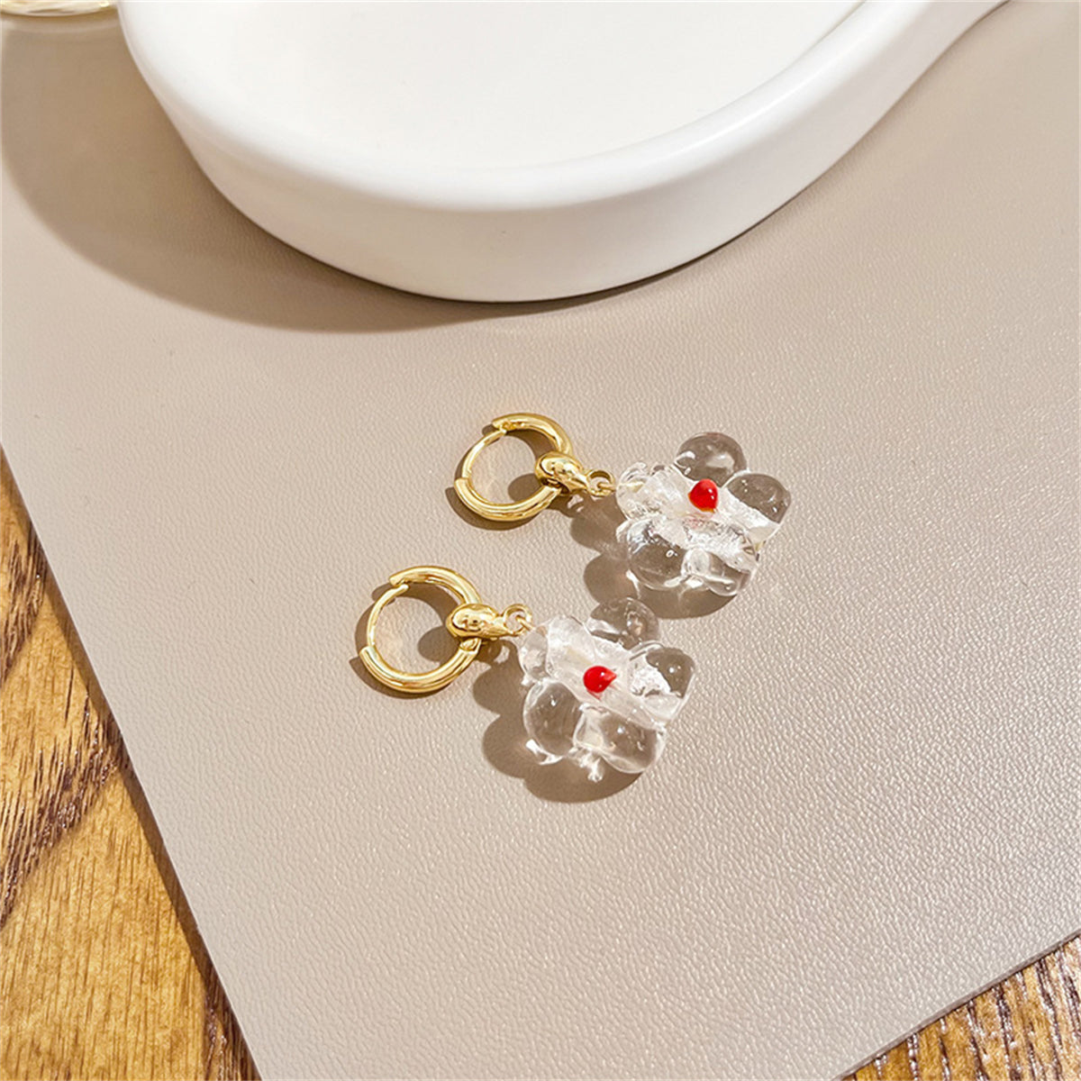 Clear Resin and 18K Gold-Plated Flower Huggie Earrings, gold huggie earrings, vintage-inspired design, detail close-up