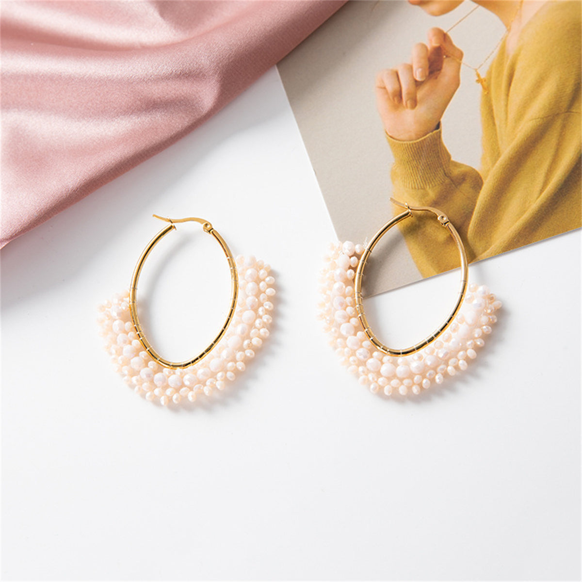 White Acrylic and 18K Gold-Plated Oval Huggie Earrings, gold huggie earrings, vintage-inspired design, side view