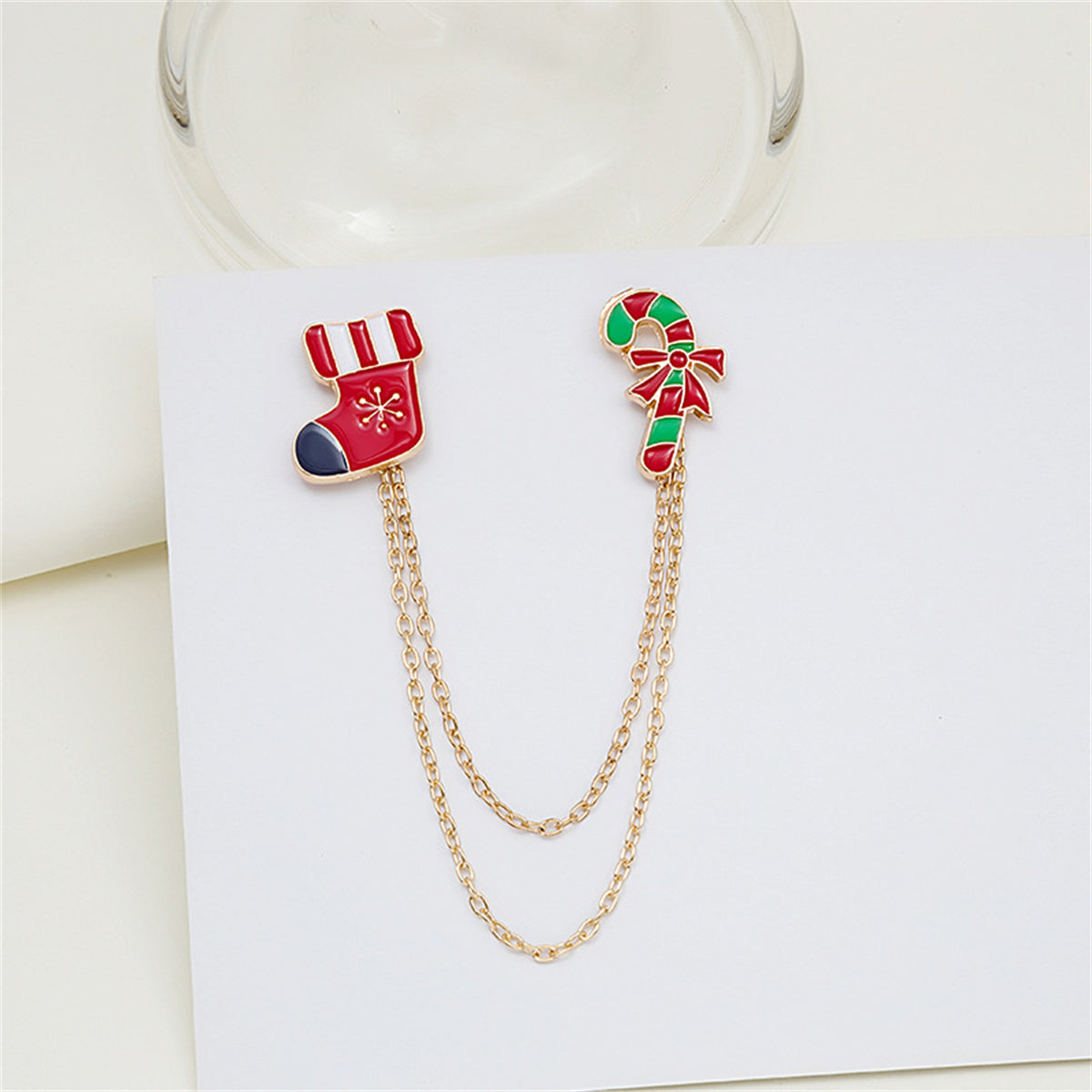 Red Enamel and 18K Gold-Plated Stocking Candy Cane Chain Brooch, gold brooch pin, vintage-inspired design, detail close-up