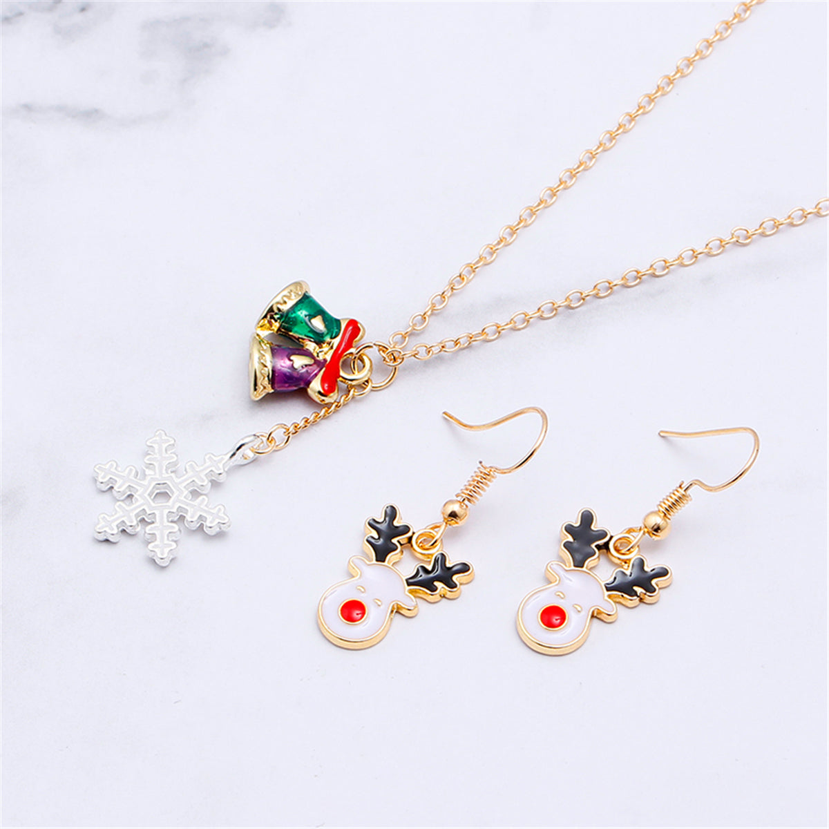 White and 18K Gold-Plated Reindeer Earrings and Snowflake Pendant Necklace, gold drop earrings for women, detail close-up