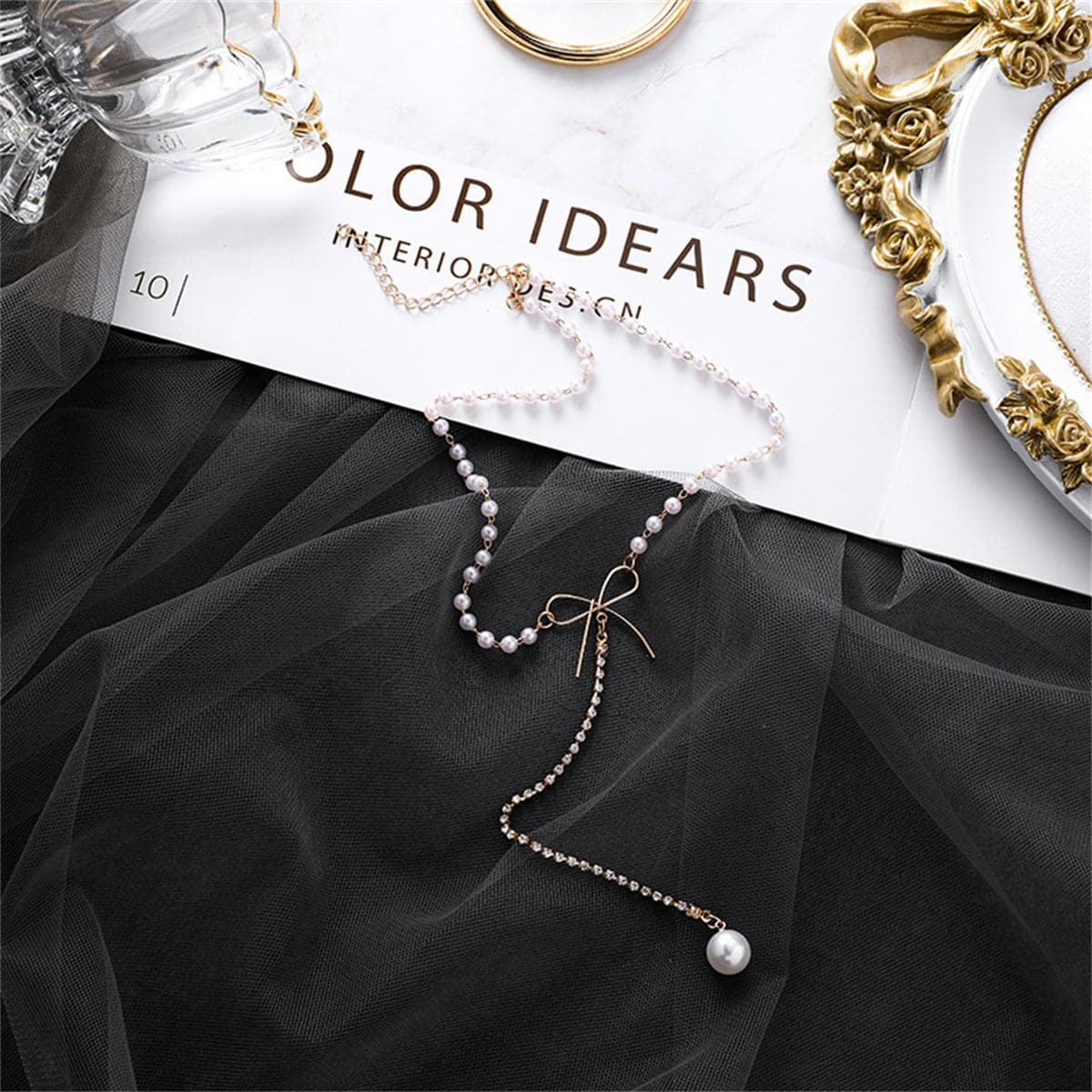 Pearl and Cubic Zirconia Bow Lariat Necklace, pendant necklace for women, vintage-inspired design, front view