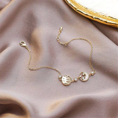 Cubic Zirconia and Shell 18K Gold Plated Round Moon Sun Charm Bracelet, gold bracelet for women, everyday style, front view