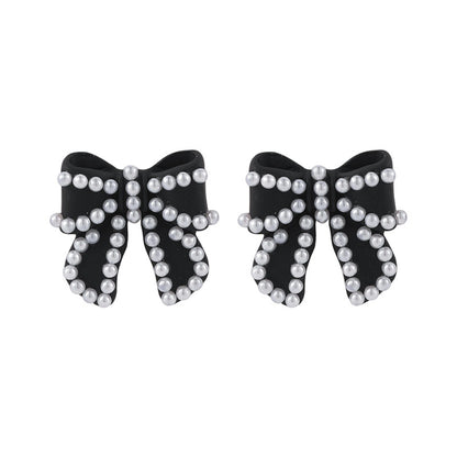 Pearl and Black Enamel Silver-Plated Bow Stud Earrings, silver stud earrings for women, botanical inspired, side view