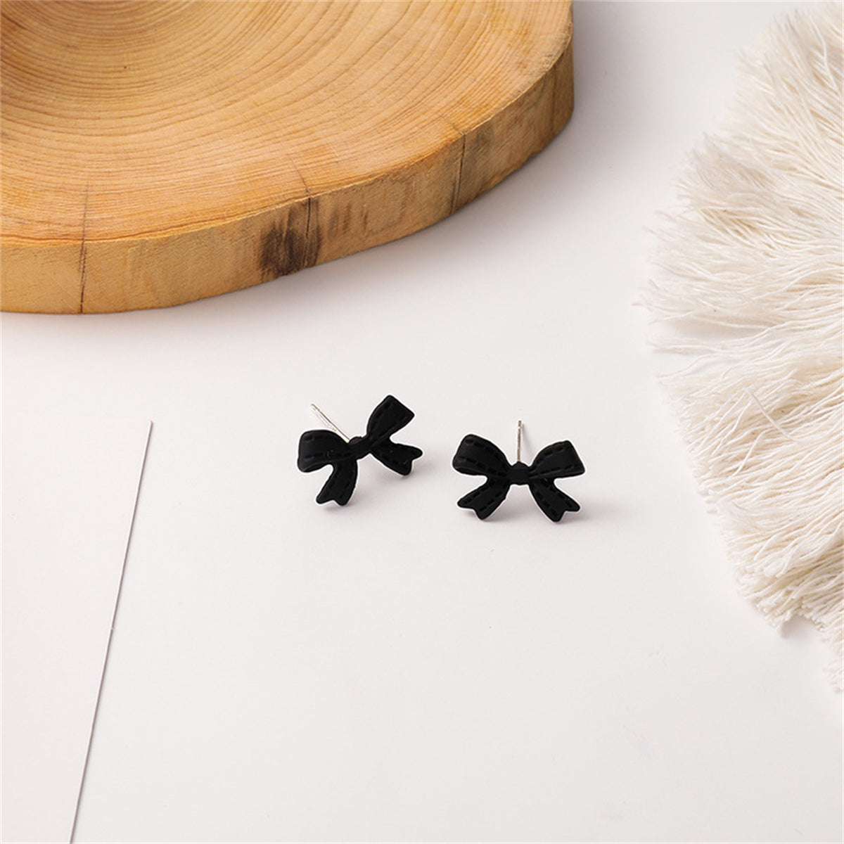 Black Enamel Bow Stud Earrings, stud earrings for women, everyday style, side view