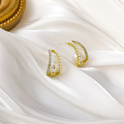 Pearl and Cubic Zirconia Curve Huggie Earrings, huggie earrings, botanical inspired, side view
